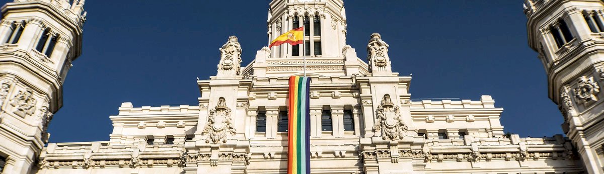madrid monument with rainbow flag